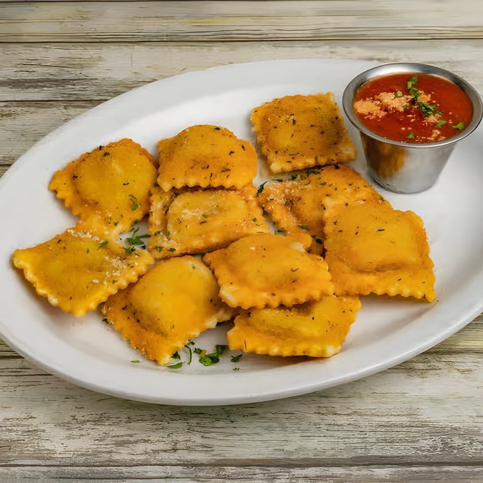 Golden fried ravioli with herbs and parmesan, served with a side of marinara sauce.